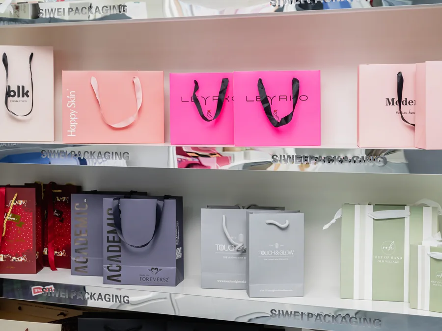 Custom paper shopping bags displayed at SiWei Packaging