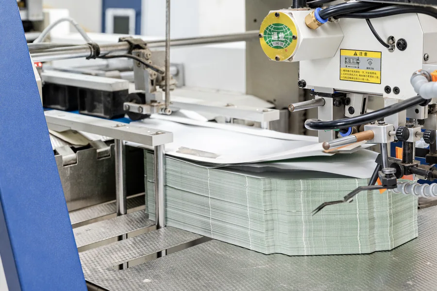 Automated paper packaging finishing and assembly