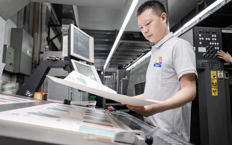 Employee visually inspecting every finished packaging product