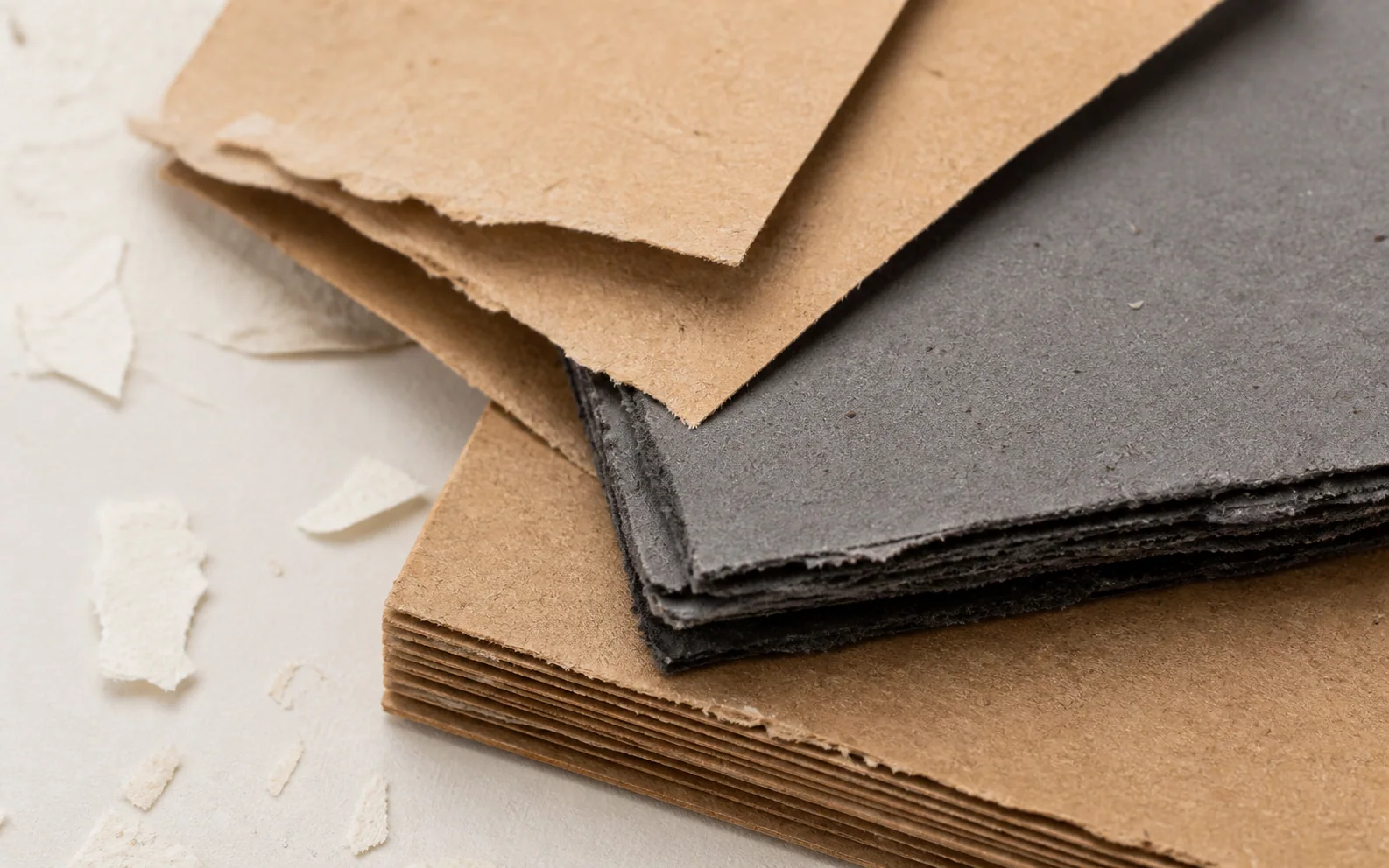 Close-up of recycled kraft paper and greyboard textures